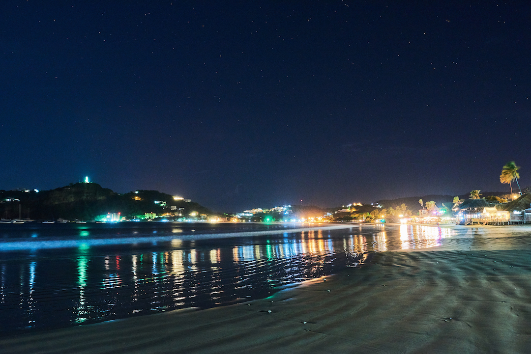 san juan del sur bay at night illuminated