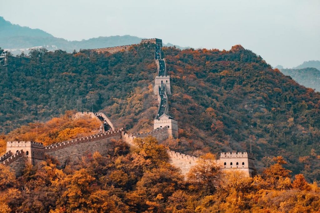 Great Wall of China with autumn foliage in the surrounding area