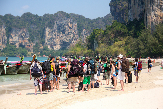 a group of backpackers on a thailand beache