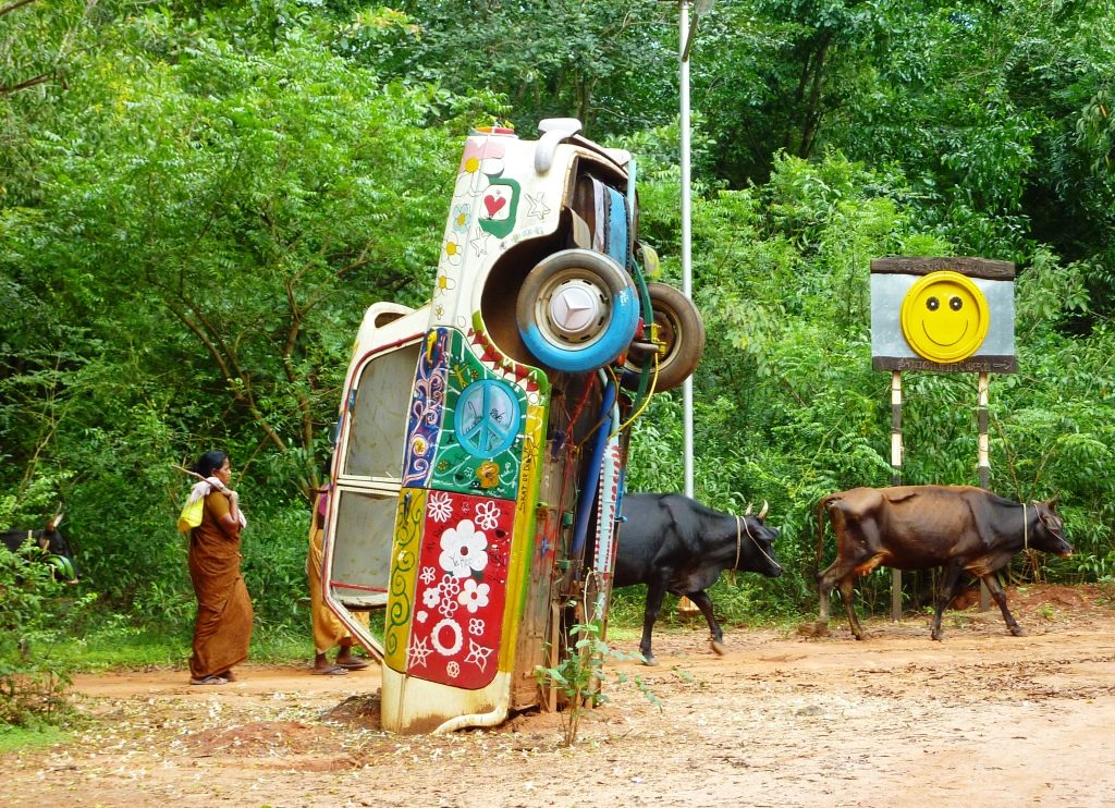 a car painted in colourful hippie design tipped back