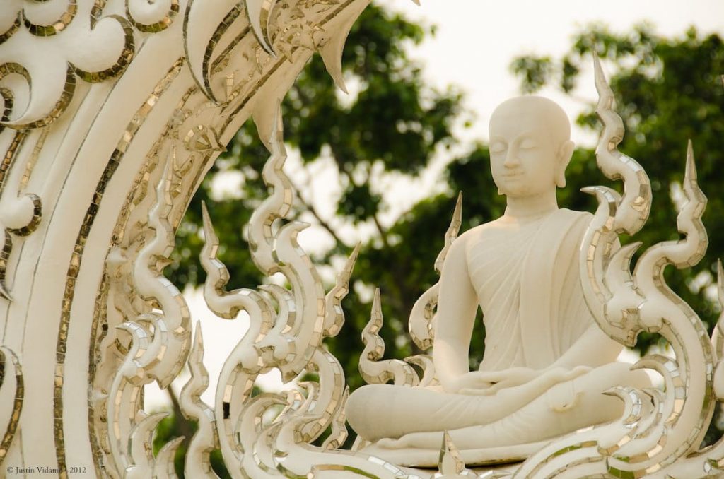 A Buddha detail on the White Temple in Chiang Rai, Thailand