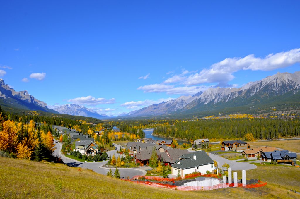 a colourful village surrounded by mountains