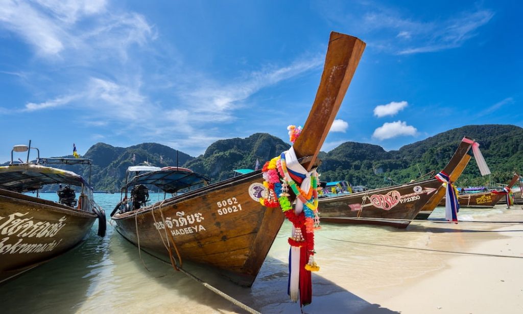 Long-tail boats on a beach in Thailand