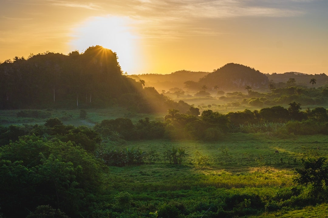 The sun setting over a valley in Vinales, Cuba