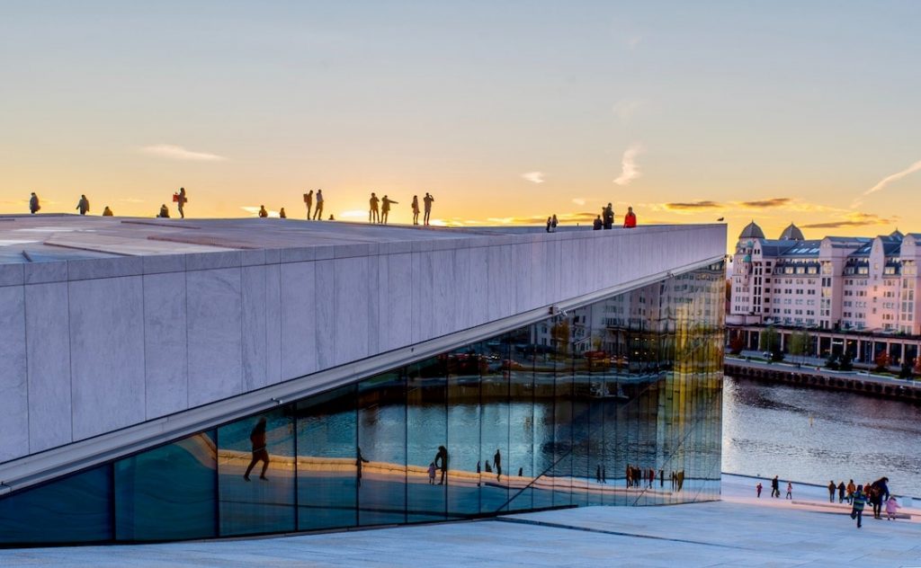 People walking on the roof of the Opera House in Oslo, Norway