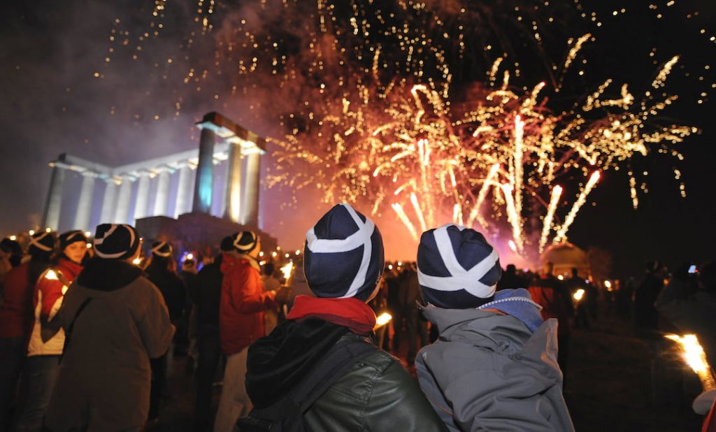 Two people watching fireworks on Hogmanay in Edinburgh, Scotland