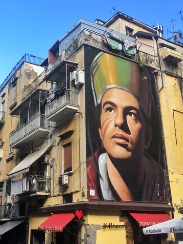 mural of a man on the side of a building