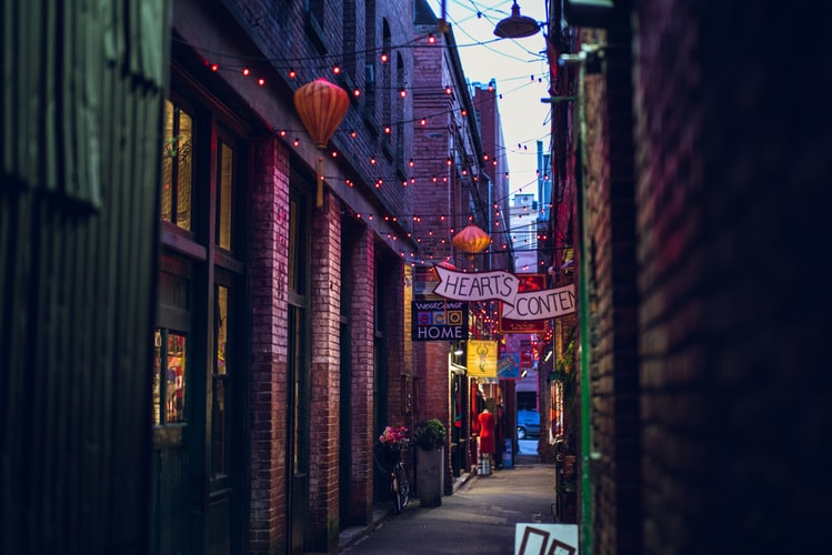 photo of a colored street with lights