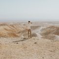 Man standing at the edge of a look-out point in Masada National Park, Israel