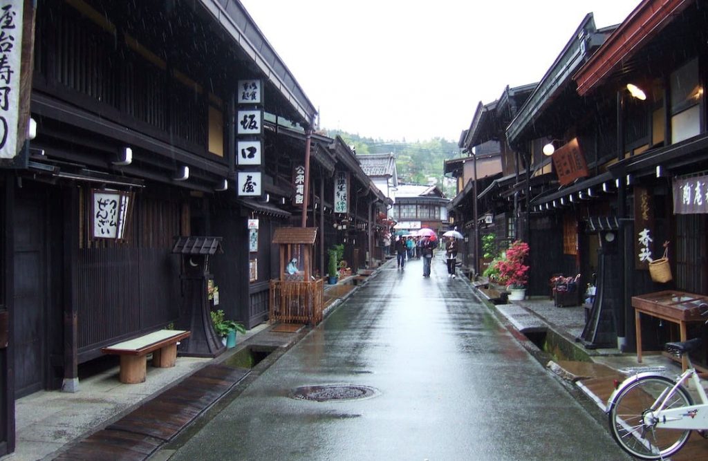 A street lined with traditional wooden buildings in Takayama, Japan