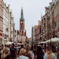 brown clock tower, a street full of busy people
