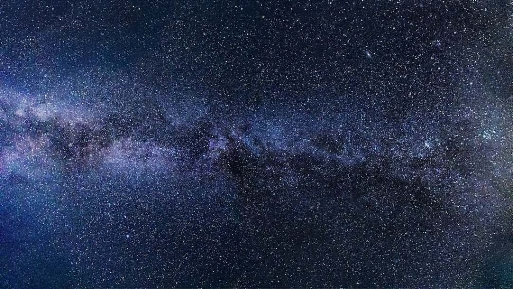 Photo of the night sky filled with stars and the Milky Way