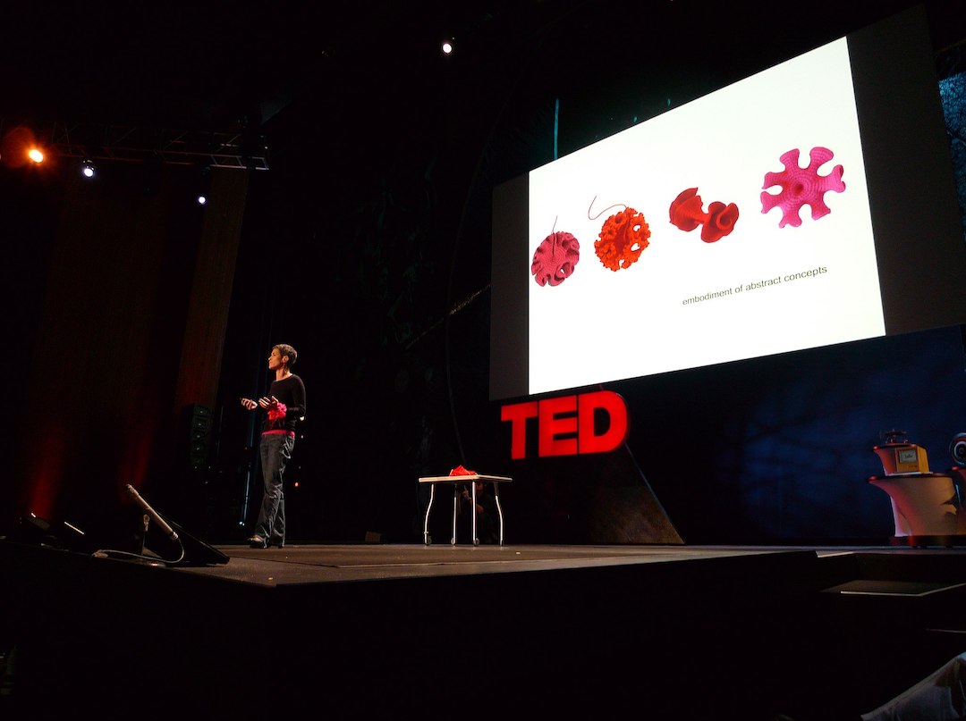 Margaret Wertheim on stage speaking at TED in 2009