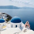 White washed and blue domed church in Santorini