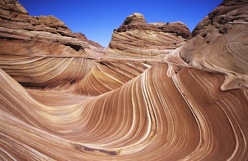 curved lines in a pattern over massive boulders 