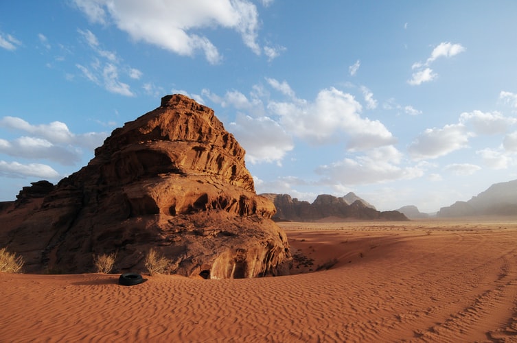 the wadi rum desert during the day: expanse of sand that looks like Mars on Earth